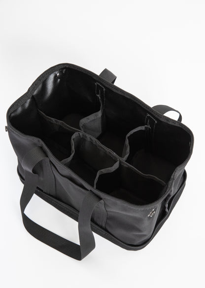 A black fabric organizer tote bag shown open, revealing multiple interior compartments and handles, photographed on a clean white background.